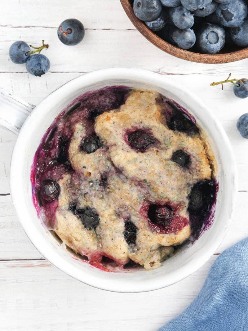 overhead view of blueberry mug muffin