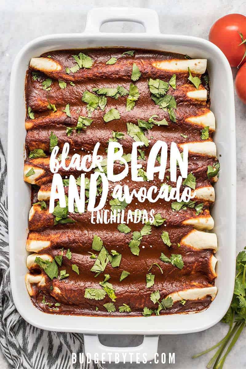 These hearty vegan Black Bean and Avocado Enchiladas are stuffed with fresh ingredients and drenched in a homemade sauce for big flavor in every bite. BudgetBytes.com