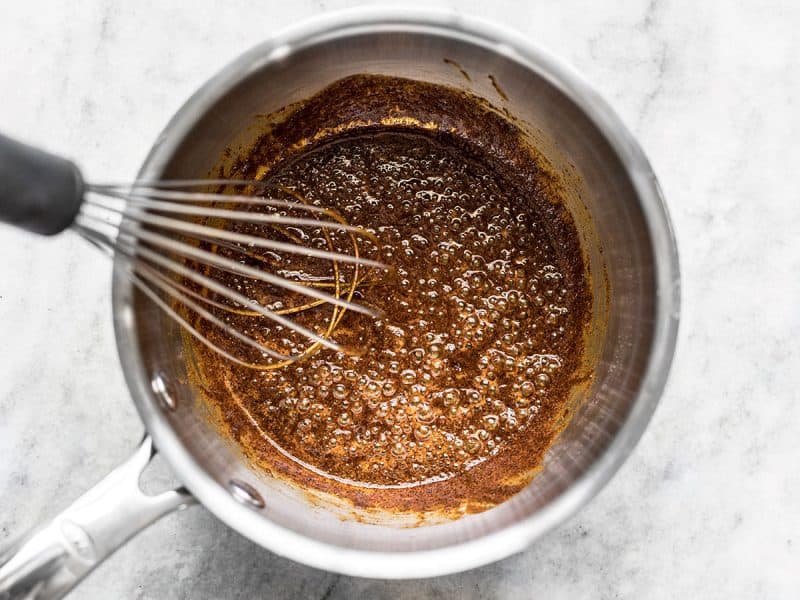 Simmering oil, flour, and chili powder