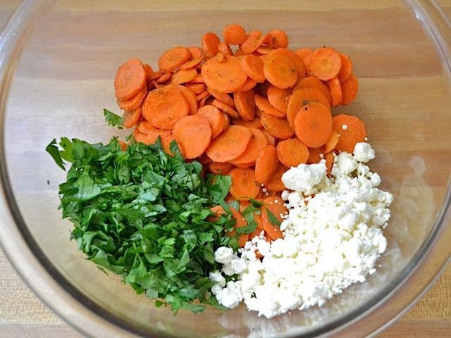 carrots, parsley and feta in mixing bowl 