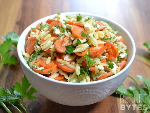 Sideview of a bowl of Carrot & Orzo Salad