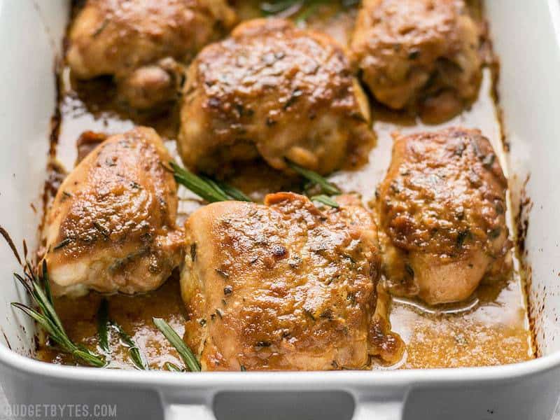 Close up of maple dijon chicken thighs in baking pan 