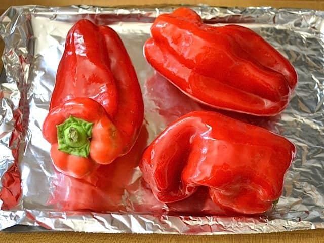 peppers coated in oil and placed on baking sheet lined with tin foil 