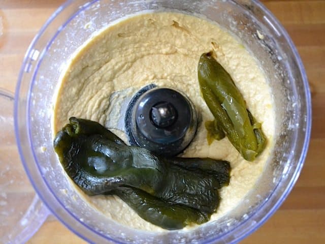 poblano peppers added to other ingredients in food processor 
