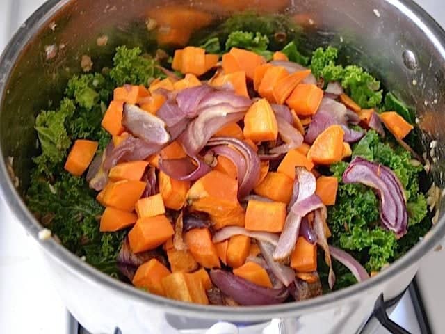 sweet potato and onion added to pot with other ingredients 