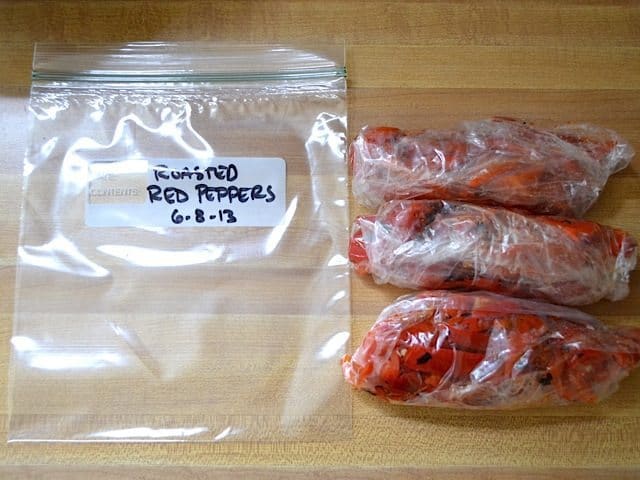 peppers divided up and placed into zip lock bags to freeze 