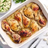 Overhead view of a pan of Greek marinated chicken.
