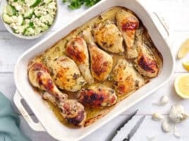 Overhead view of a pan of Greek marinated chicken.