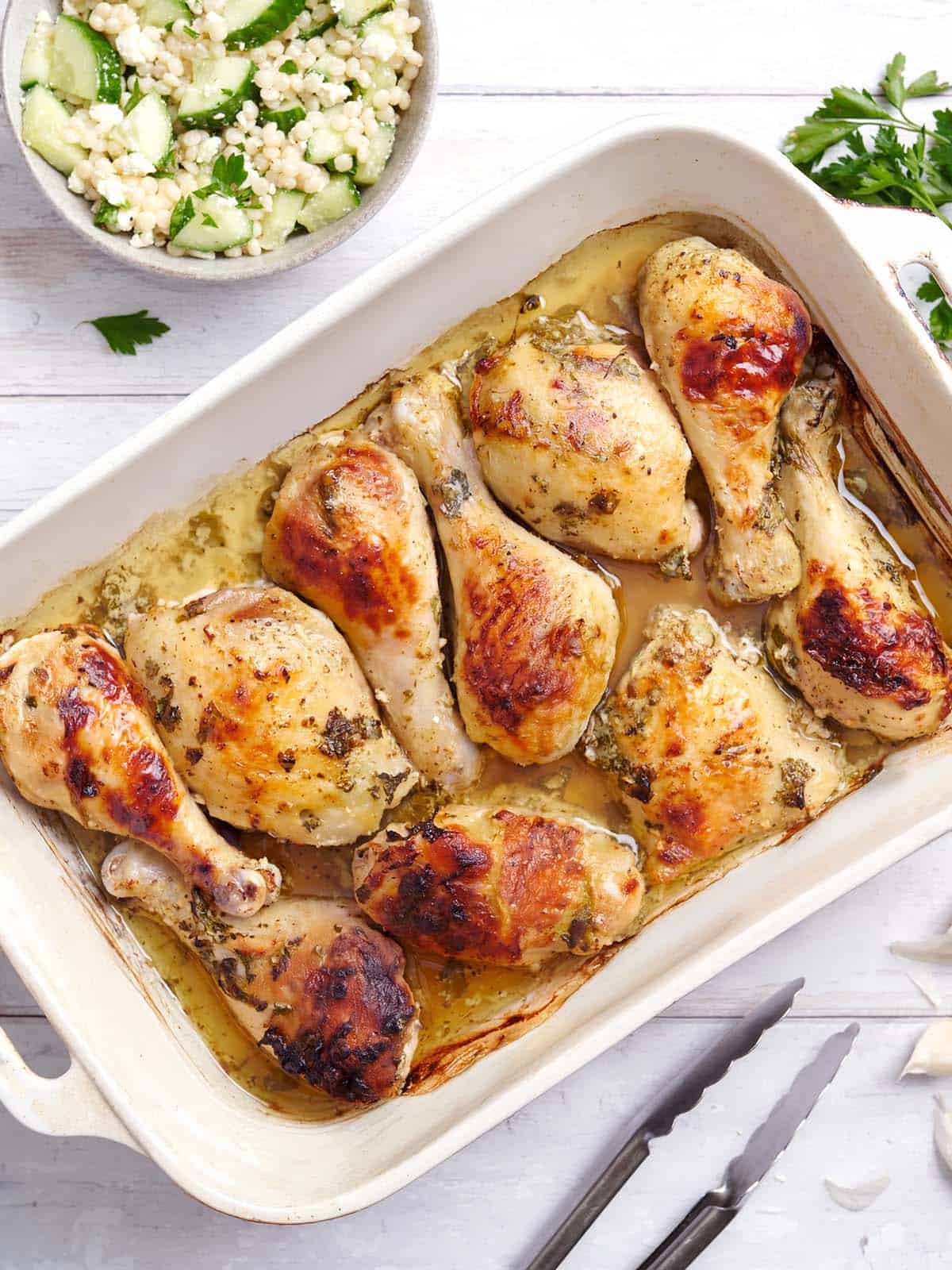 Overhead view of a pan of Greek marinated chicken.