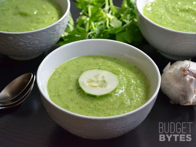 Bowl of Green Gazpacho with spoon on the side 