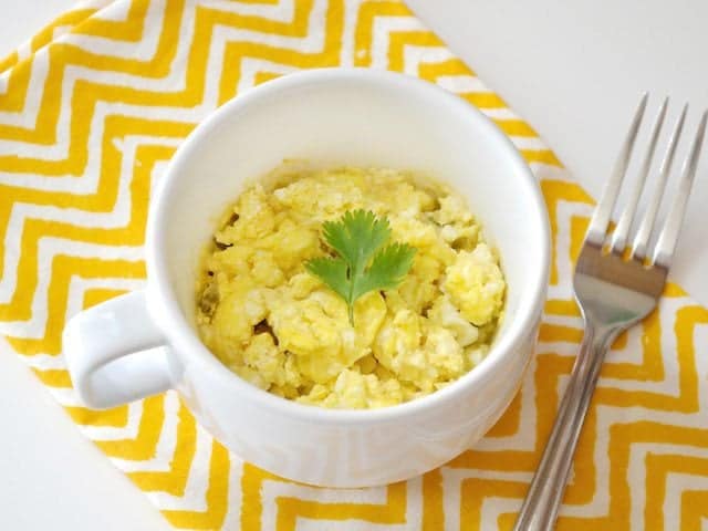 Top view of a Hummus Breakfast Mug with a fork on the side