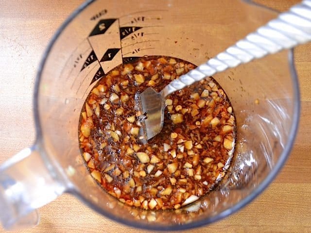 Teriyaki Sauce ingredients in measuring cup with fork 
