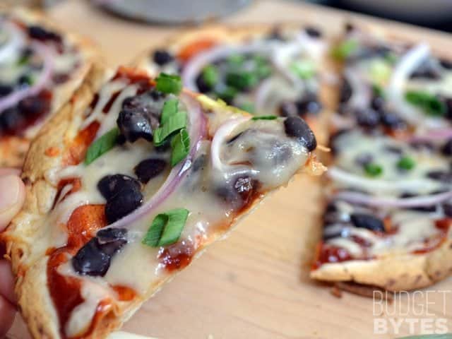 Close up of a slice ofcCrispy BBQ Black Bean Pizza