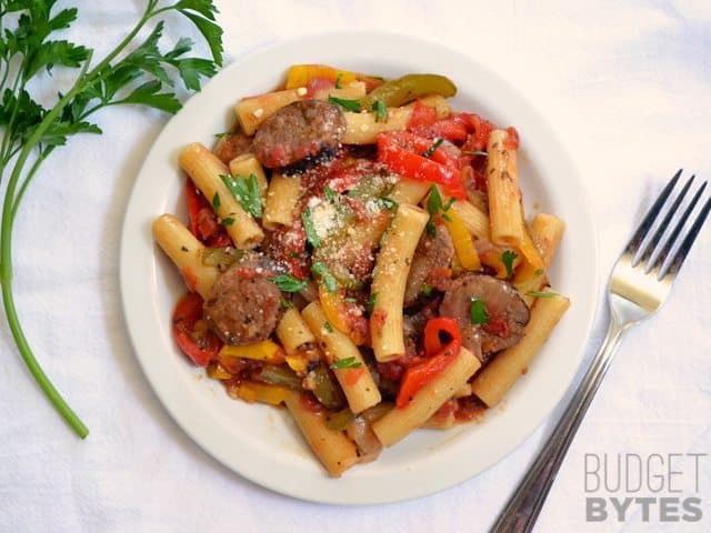 top view of a plate of Sausage & Pepper Pasta with fork on the side 