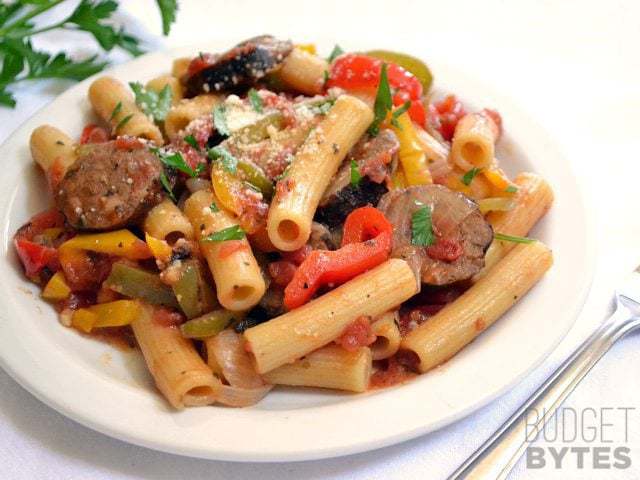 A plate of Sausage & Pepper Pasta with fork on the side 