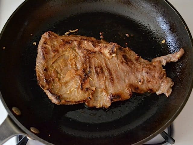 Searing Steak in hot skillet 