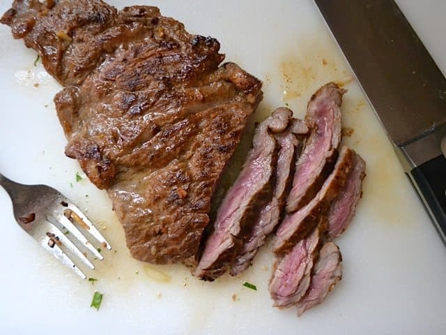 Slicing steak into thin slices 