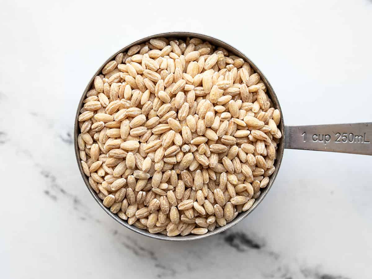 close up of pearled barley in a measuring cup