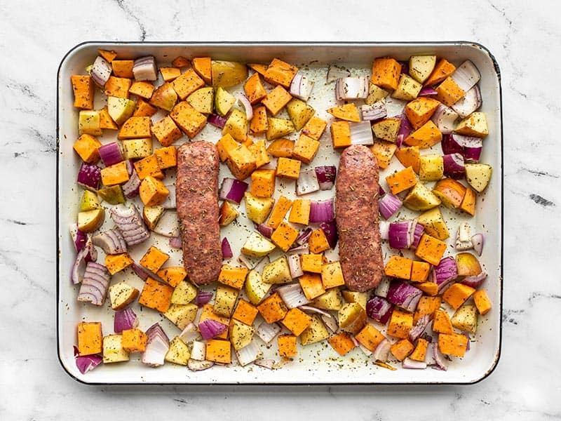 autumn medley ready to roast on the sheet pan