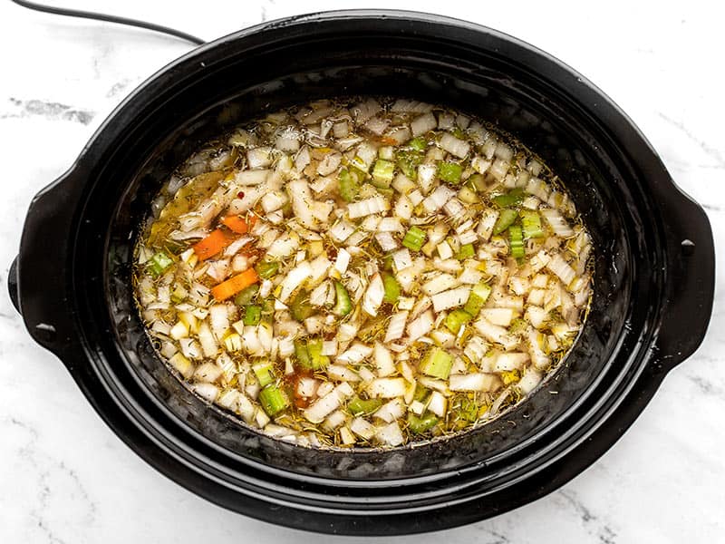 Stir uncooked soup in slow cooker
