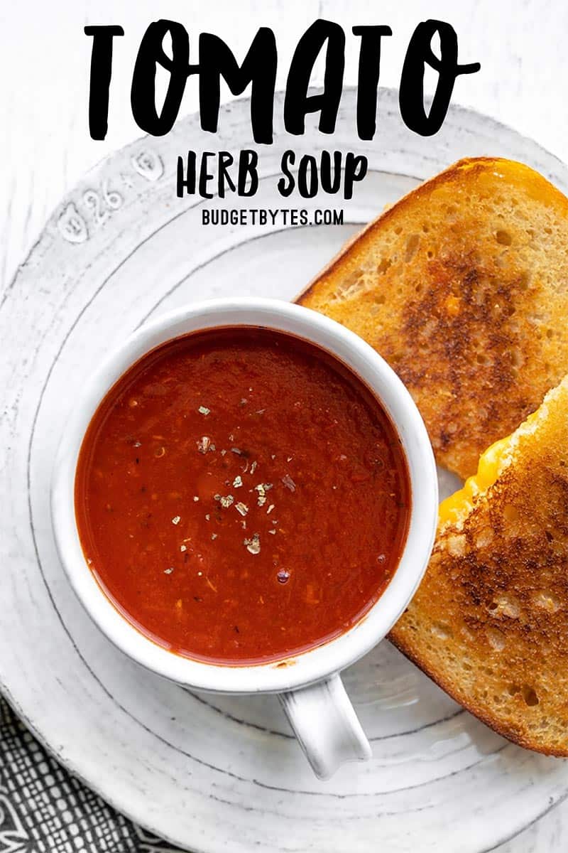 Overhead view of a mug of tomato herb soup, title text at the top