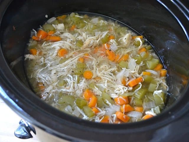 Shredded Chicken and Salt added into slow cooker 