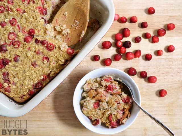 Tray of Cranberry Apple Baked Oatmeal with a small amount scooped into bowl 