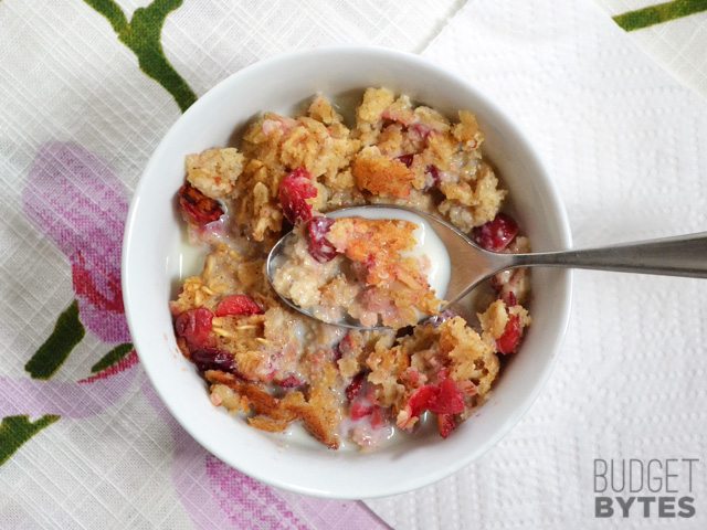 Top view of a bowl of Cranberry Apple Baked Oatmeal with spoon 