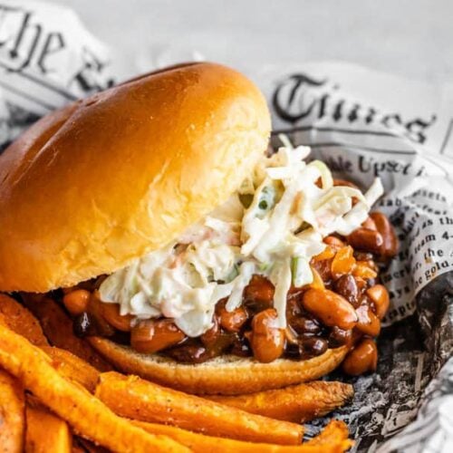 Side view of a BBQ Bean Slider on a plate with some sweet potato fries