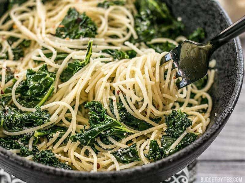 Close up of Garlic Parmesan Kale Pasta Twirled Around a Fork