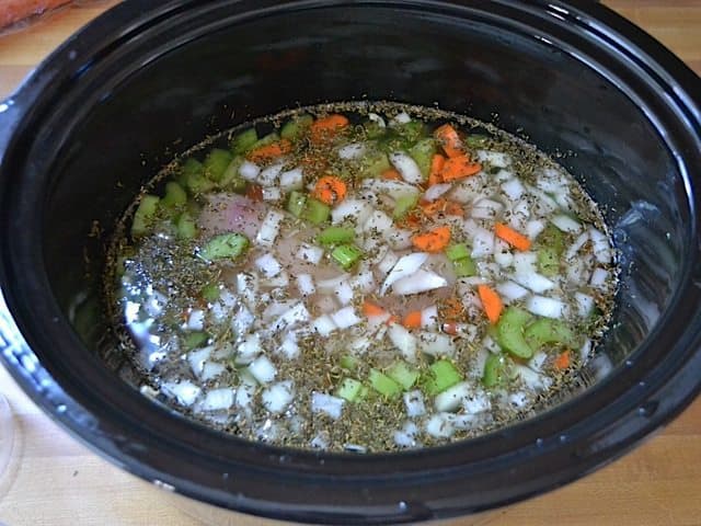 Water added to ingredients in slow cooker 