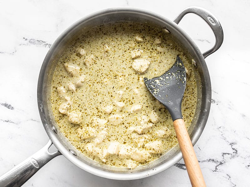 Smooth and creamy pesto sauce in the skillet