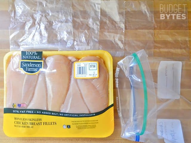 Zip lock bags with top folded down to put chicken breast in