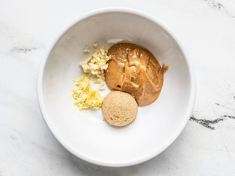 Peanut butter, brown sugar, garlic, and ginger in a bowl