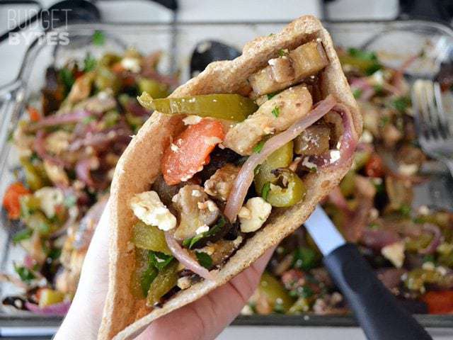 Close up of Greek Stuffed Pita filling inside half a pita bread 