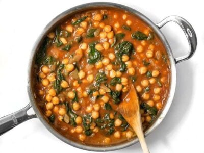 These super fast Curried Chickpeas with spinach are packed with flavor and nutrients, vegan, gluten-free, and filling! Plus they freeze great! BudgetBytes.com