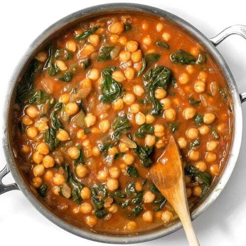 These super fast Curried Chickpeas with spinach are packed with flavor and nutrients, vegan, gluten-free, and filling! Plus they freeze great! BudgetBytes.com