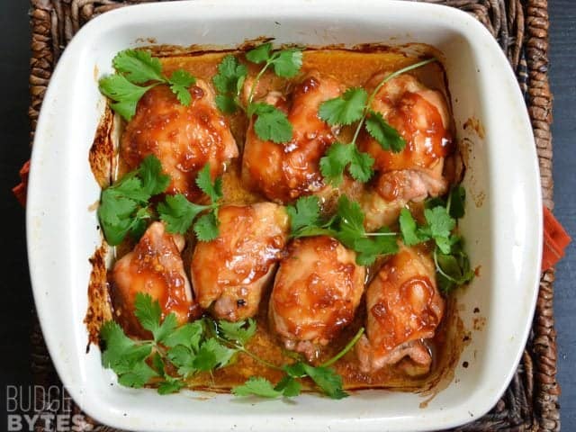 Top view of finished Honey Sriracha Chicken Thighs in baking pan 
