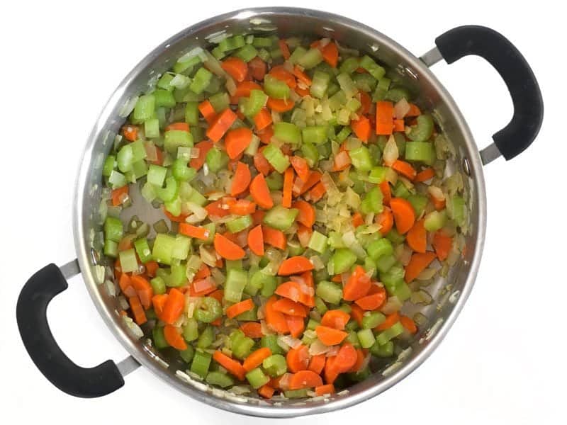 Celery and Carrots added to pot to cook 