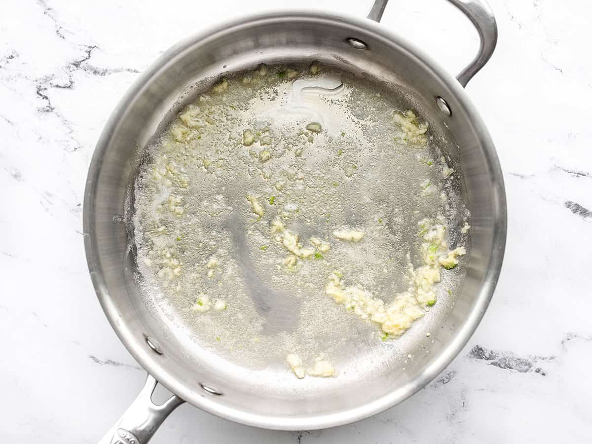 garlic sautéed in butter in the skillet