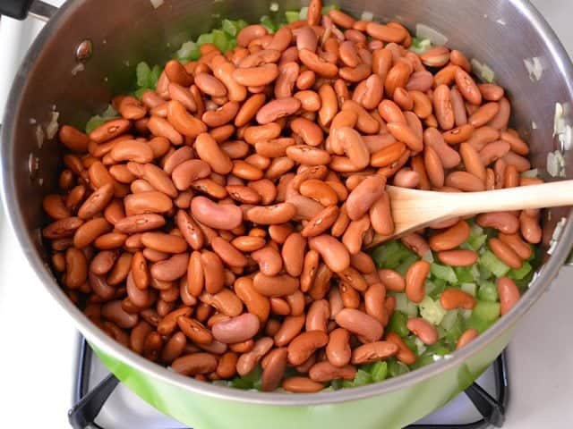 Soaked beans added to pot of veggies 