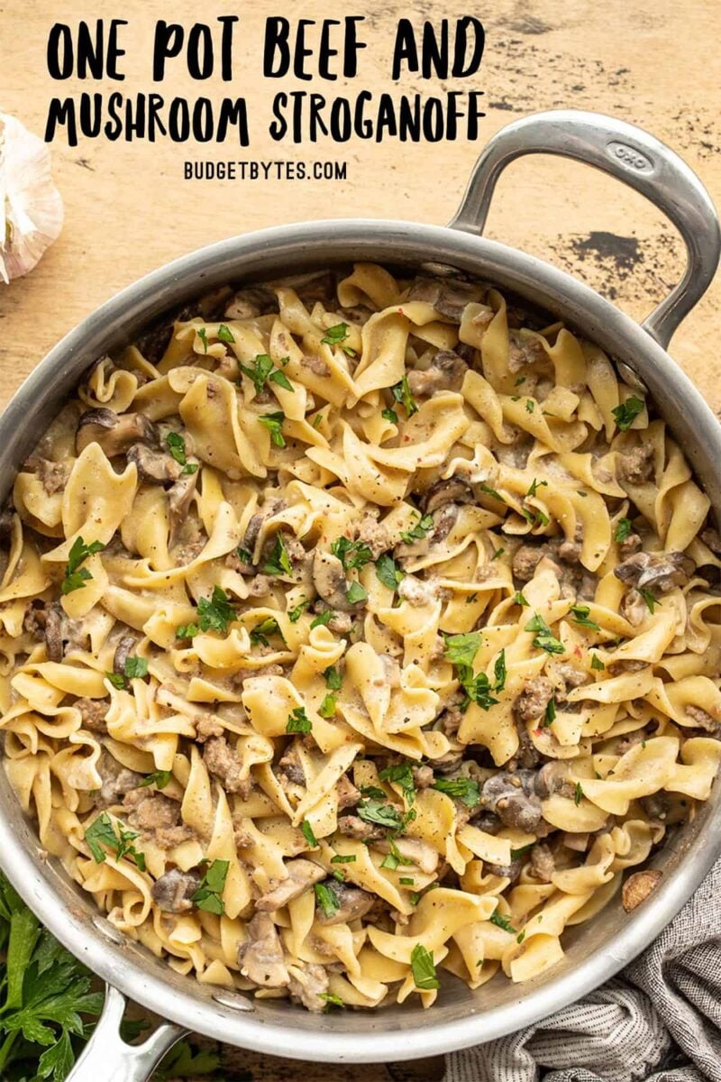 overhead view of one pot beef and mushroom stroganoff in the skillet with title text at the top