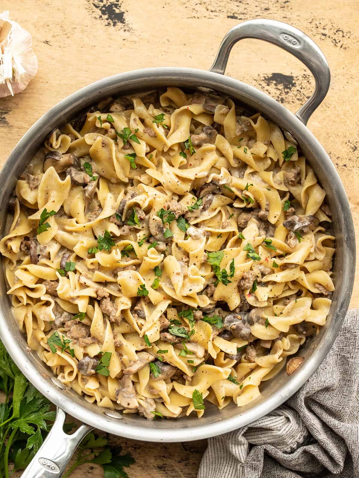 overhead view of a skillet full of beef and mushroom stroganoff