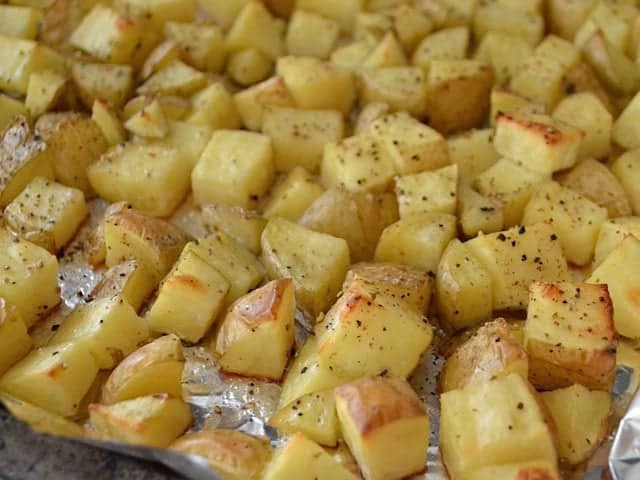 Finished roasted potatoes on baking sheet 