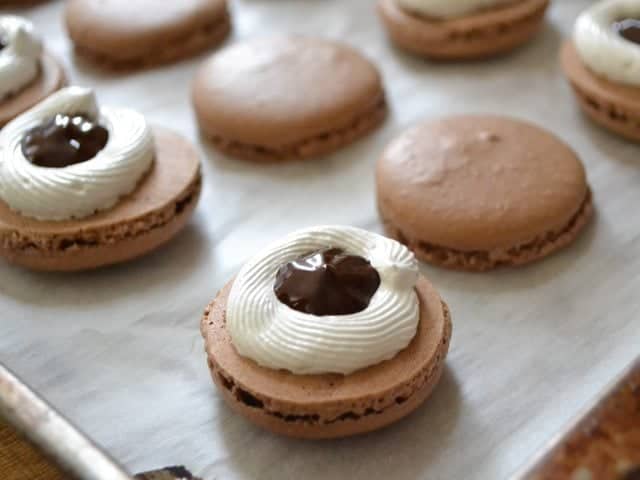 Chocolate ganache filled in center of meringues 