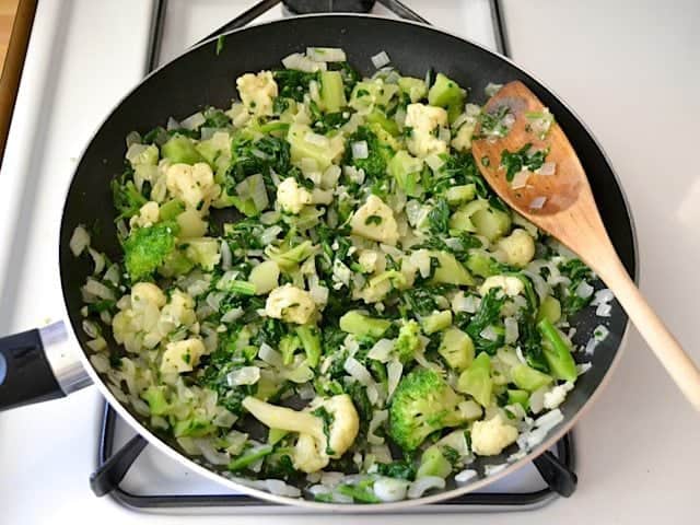 Vegetables, onion and garlic cooking in pan 