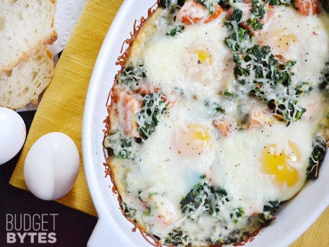 Close up of a dish of Baked Eggs with Spinach and Tomatoes