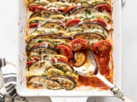 oven roasted ratatouille with a portion scooped out of the corner