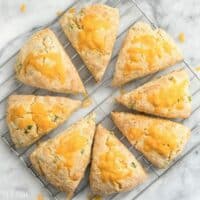 These soft, flakey Cheddar Scallion Scones are a breeze to prepare and make a great side for soups, stews, and chili! BudgetBytes.com