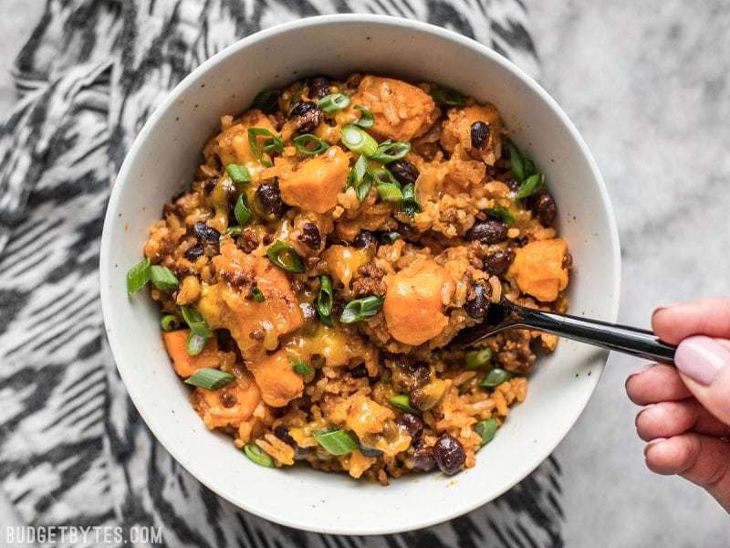 Top view of a bowl of sweet potato chorizo skillet with a fork 